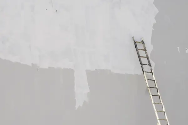 Exterior painting in Little Rock: ladder against a freshly primed wall